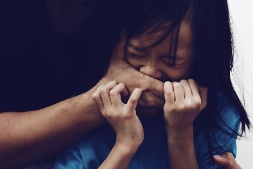 Man’s hands covering mouth of scared young girl prior to sex crime, which the man - if convicted - will not be able to get a COR for in California