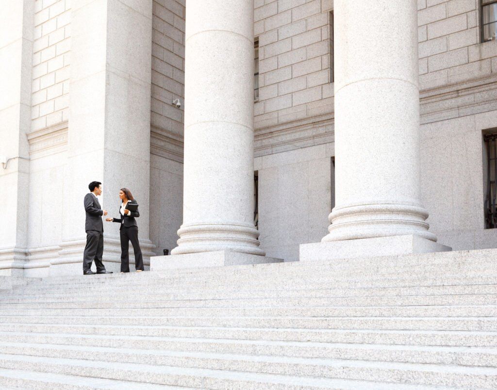 Two attorneys on courthouse steps